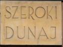 powiększ